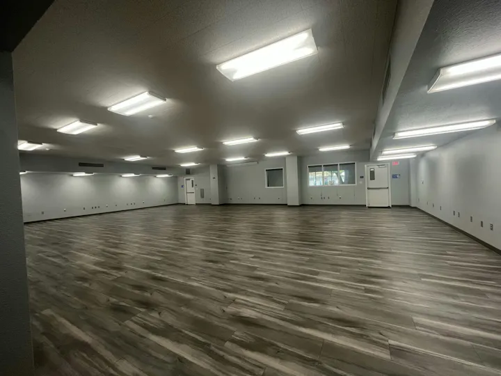 May contain: floor, lamp, indoors, ballroom, room, flooring, and interior design