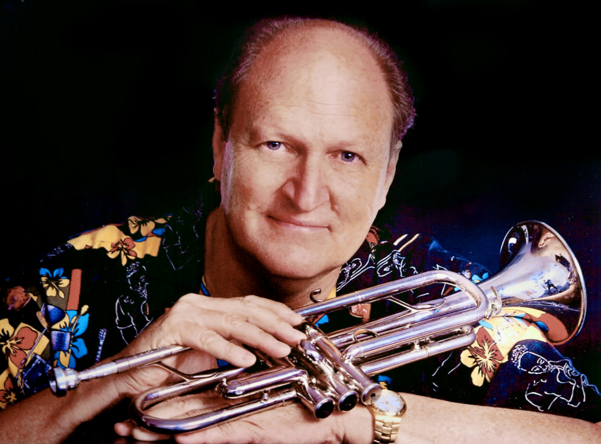 May contain: person, human, trumpet, brass section, cornet, horn, and musical instrument