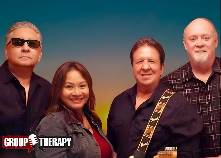 A music group posing together with instruments, featuring four members, set against a colorful background.