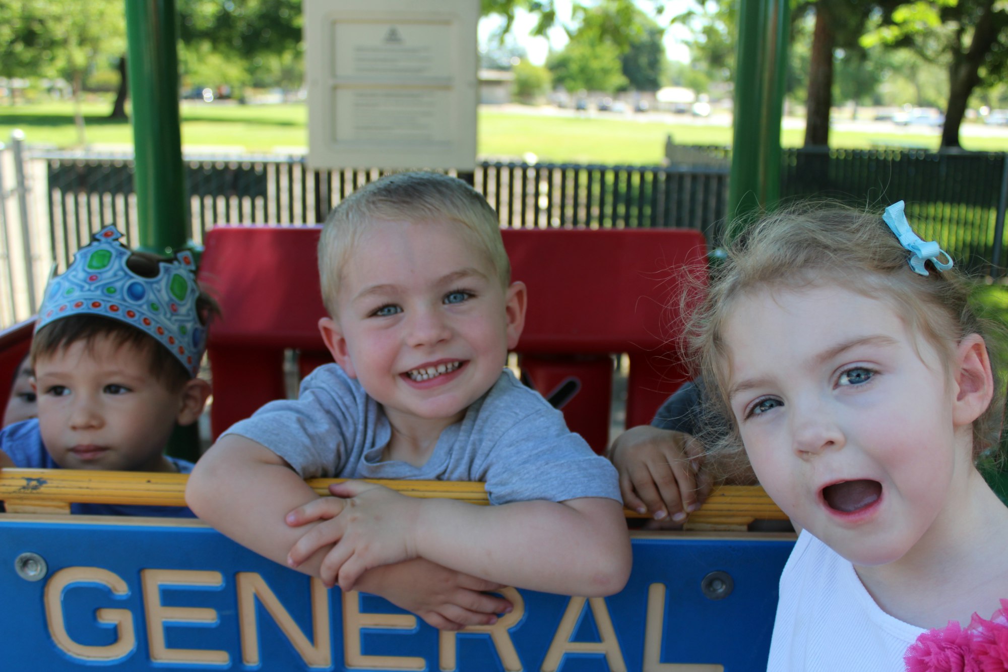 May contain: person, human, hat, clothing, apparel, playground, and play area