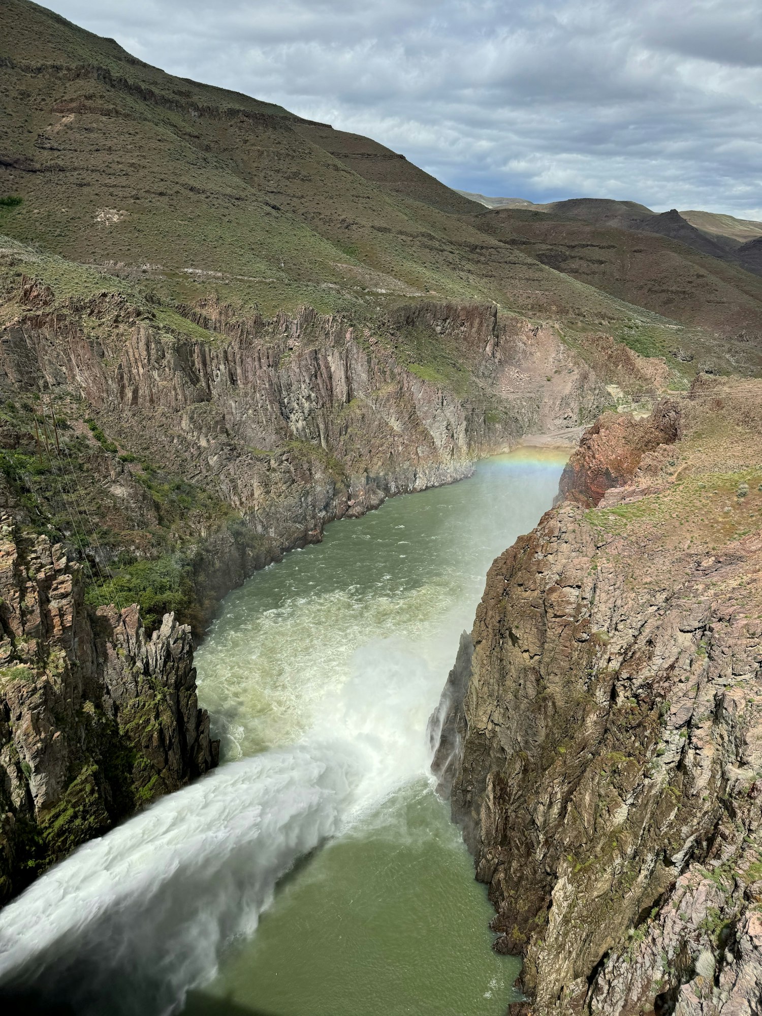 May contain: outdoors, nature, cliff, water, mountain, and valley