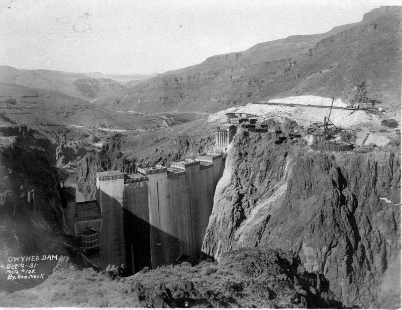 The image shows Owyhee Dam, under construction in a mountainous landscape, dated October 1931.