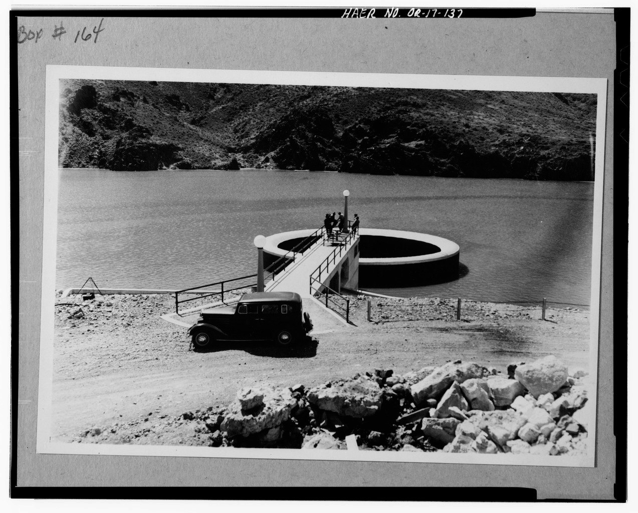 May contain: road, car, transportation, vehicle, and handrail