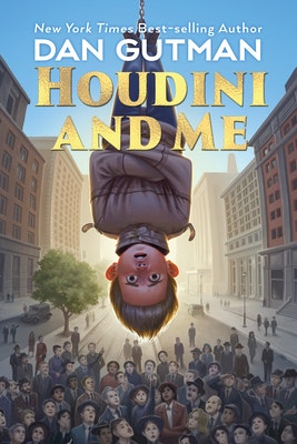 Book cover of "Houdini and Me" by Dan Gutman, featuring a boy hanging upside down over a city street crowd.