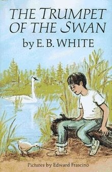 Cover of "The Trumpet of the Swan" by E.B. White. A boy sits by water with swans; illustrated by Edward Frascino.