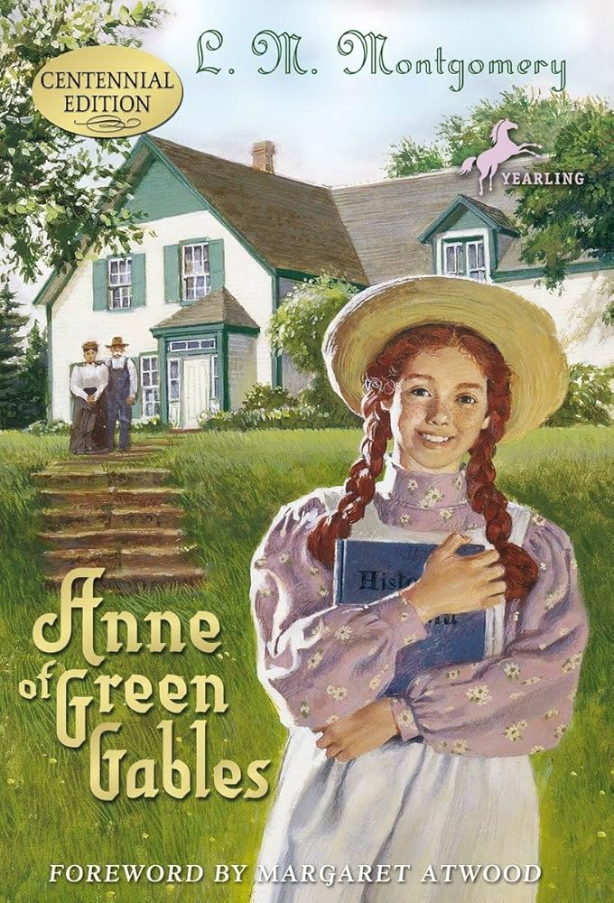 Book cover of "Anne of Green Gables" by L.M. Montgomery, featuring a girl in a hat holding a book, with a house in the background.