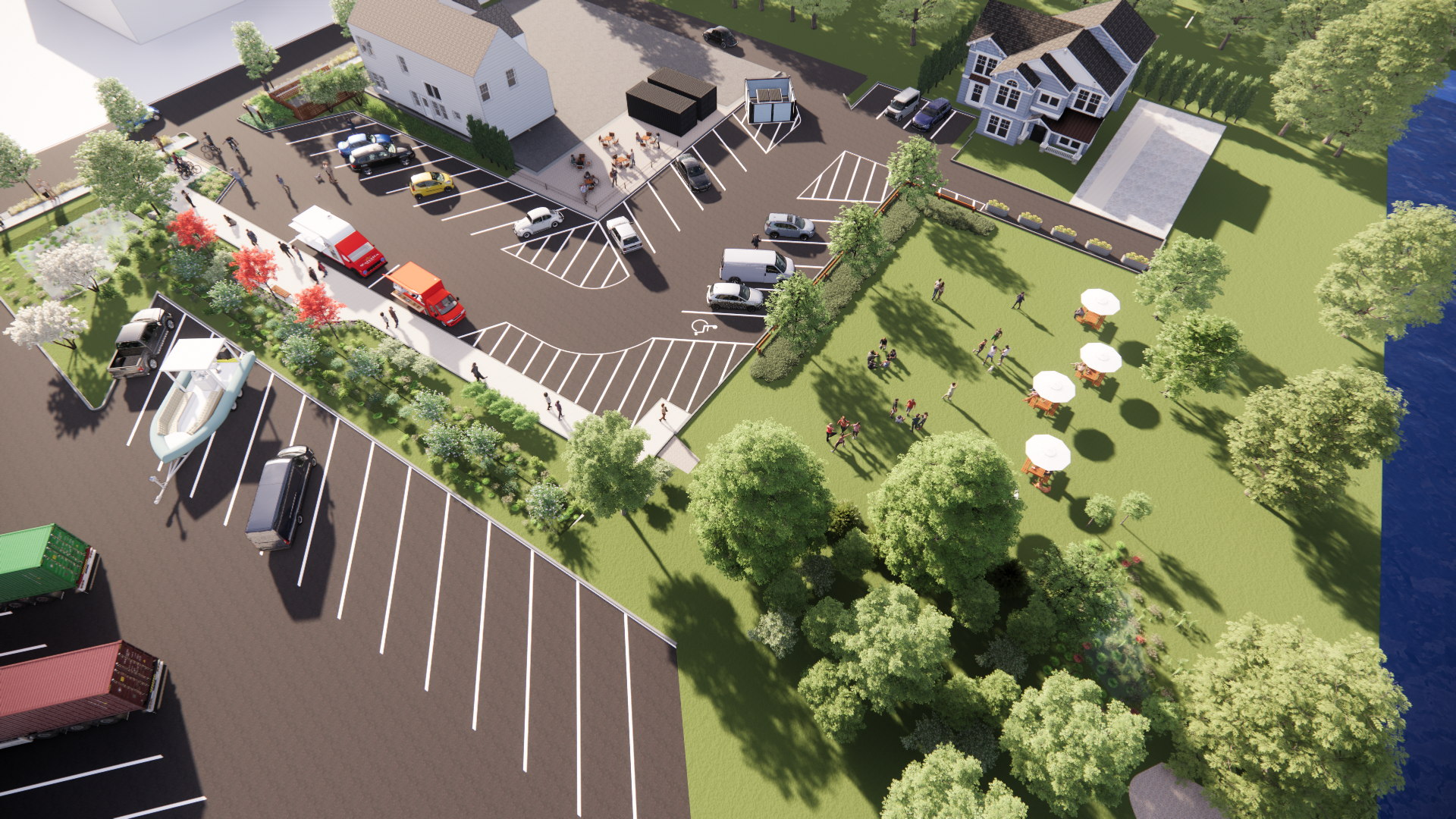 Aerial view of a parking lot, food trucks, people, houses, greenery, and a riverside area with umbrellas.