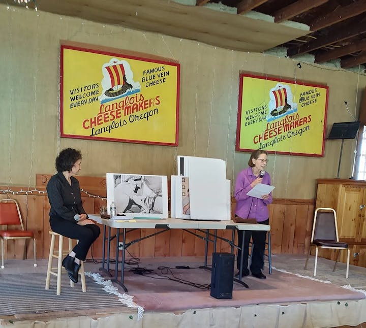 two women at a table presenting about the book cheese war