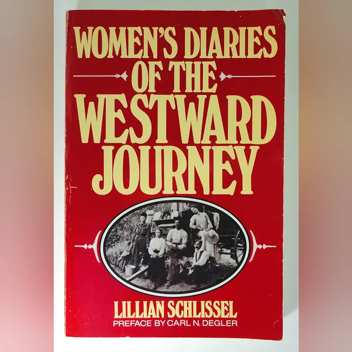 The image is a book cover titled "Women's Diaries of the Westward Journey" by Lillian Schlissel, featuring a historical photo of women.