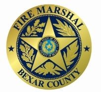 The image features a gold badge with a star, reading "FIRE MARSHAL" and "BEXAR COUNTY."