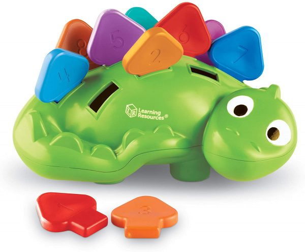 A colorful dinosaur-shaped toy with numbered shapes for a sorting game.