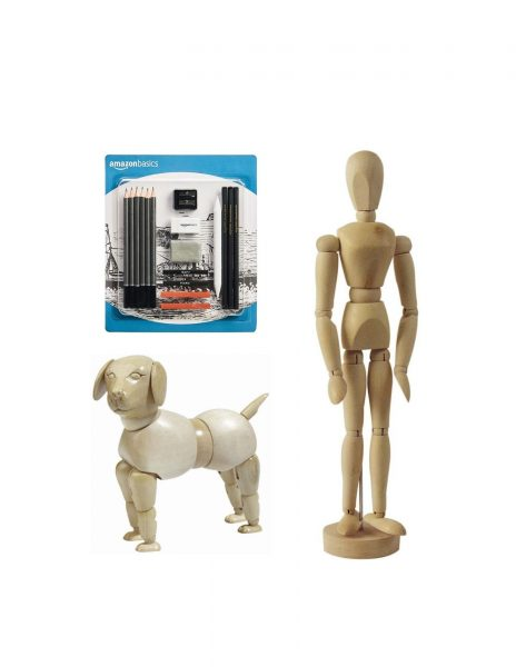 Packaging of AmazonBasics batteries, a wooden mannequin, and a wooden dog figure.