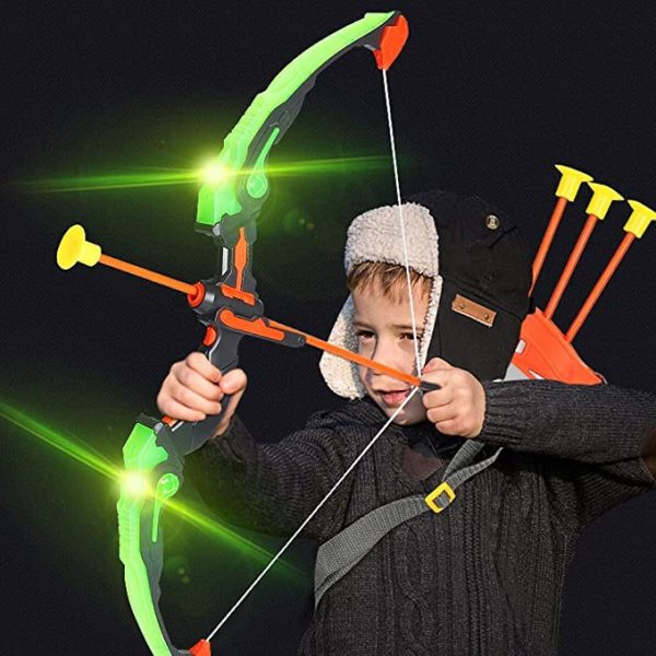 A child with a toy bow and light-up arrow, aiming playfully.
