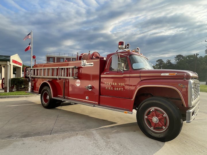 May contain: transportation, vehicle, flag, machine, wheel, fire truck, and truck