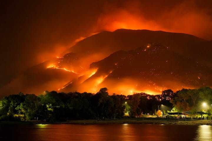 wildland fire climbing up a hill