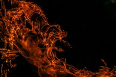 Intense flames with dynamic orange patterns against a dark background.