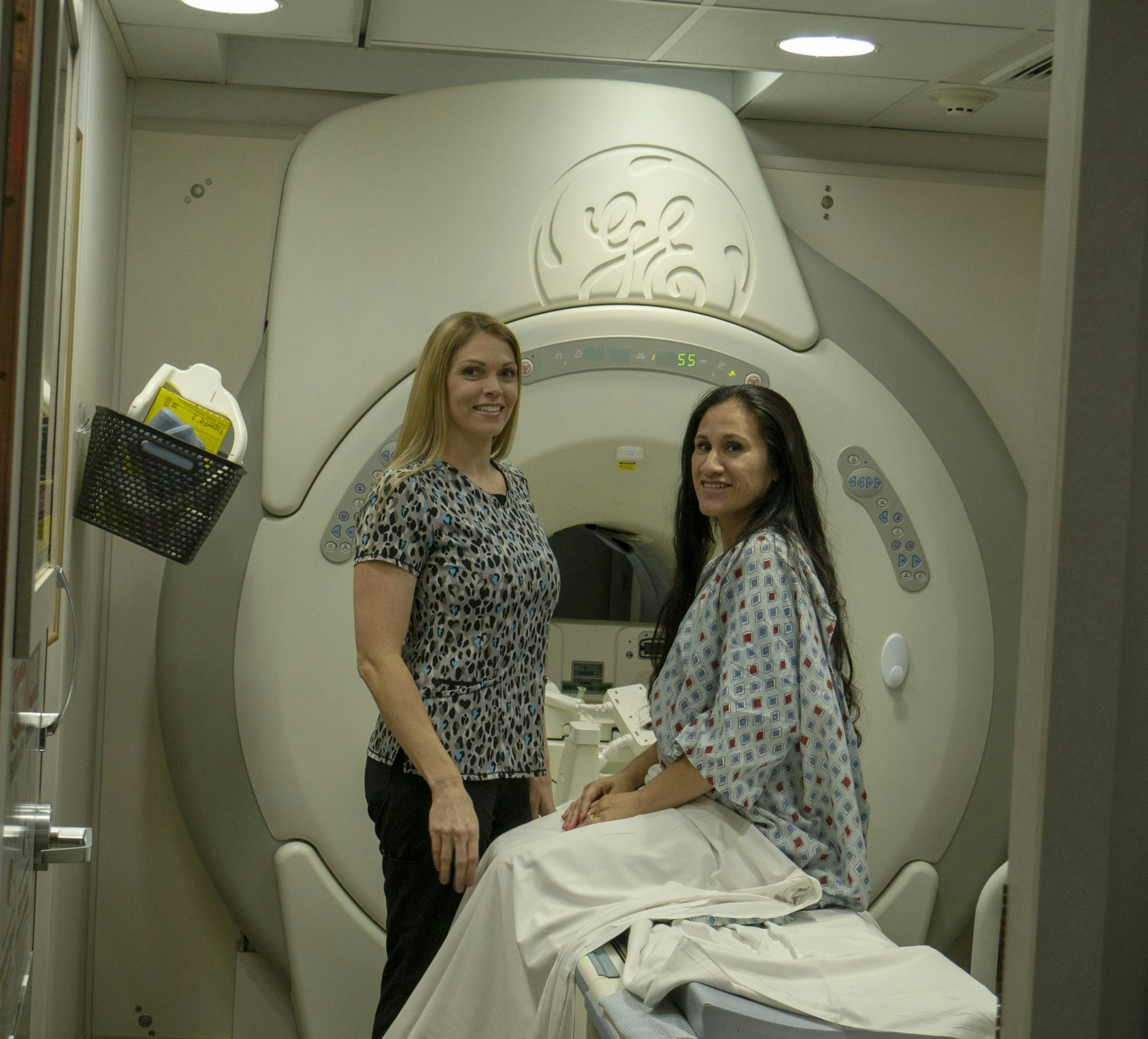 May contain: ct scan, person, woman, adult, female, hospital, building, architecture, blouse, and clothing