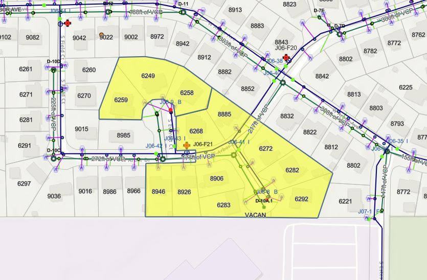 The image shows a map featuring streets, utility lines, and highlighted areas, possibly for planning or development purposes.