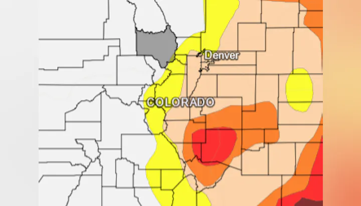 The image shows a weather map of Colorado with color-coded areas indicating various conditions or warnings, including Denver.