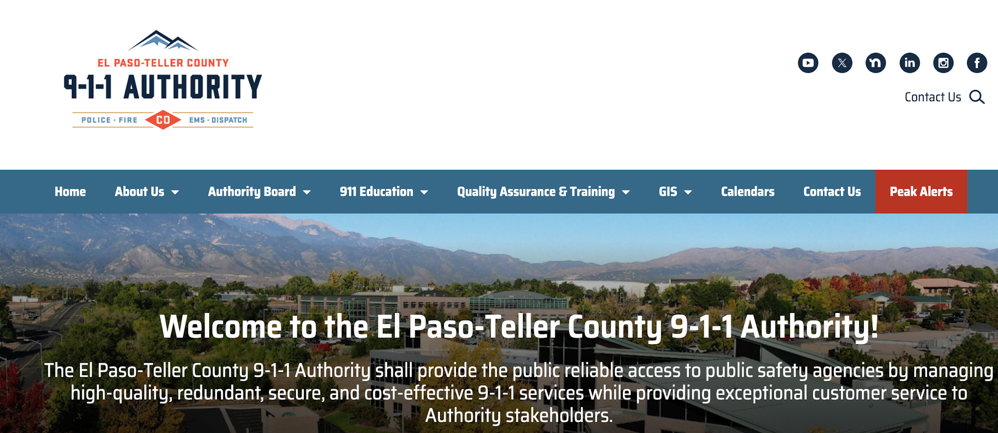 El Paso-Teller County 911 Authority webpage with menu, mountain view, and emergency service information.