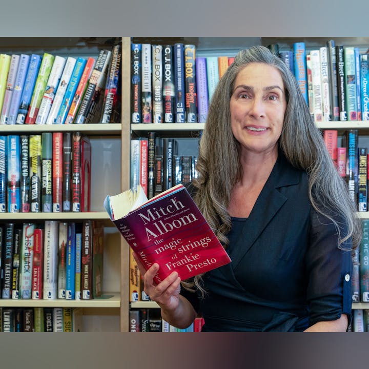 May contain: book, publication, indoors, library, shelf, adult, female, person, woman, furniture, and bookcase