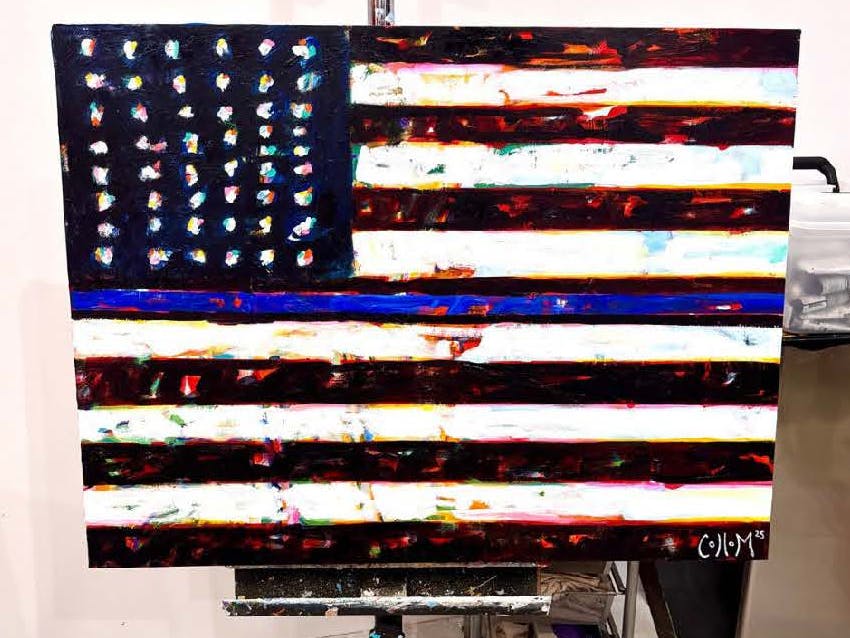 Abstract American flag painting on an easel, part of a fundraiser for Sacramento Police Foundation.