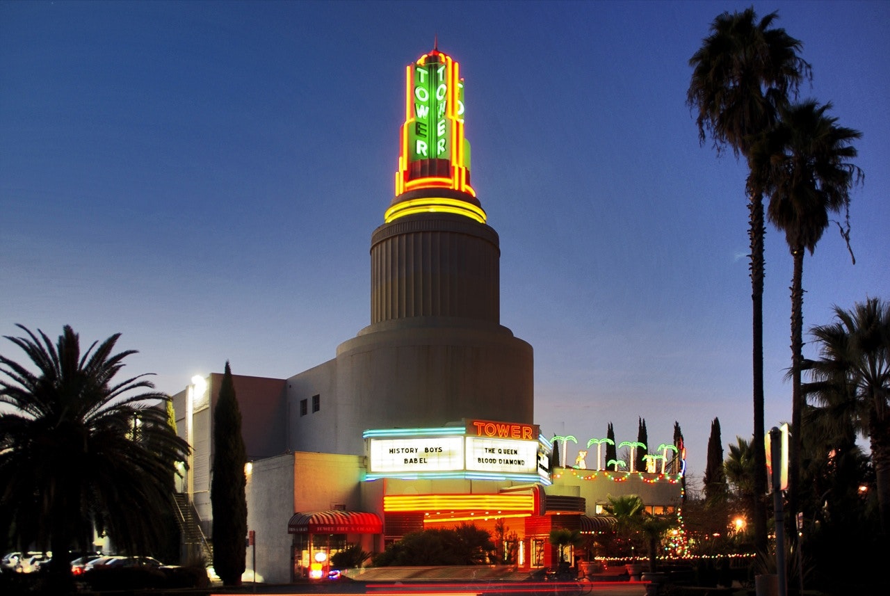 May contain: tower theatre, neon lights, darkening sky
