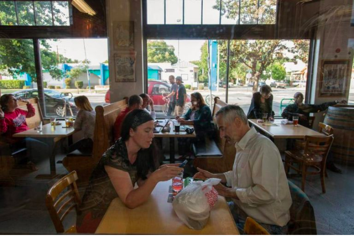 May contain: restaurant, human, person, food court, food, furniture, chair, and cafe