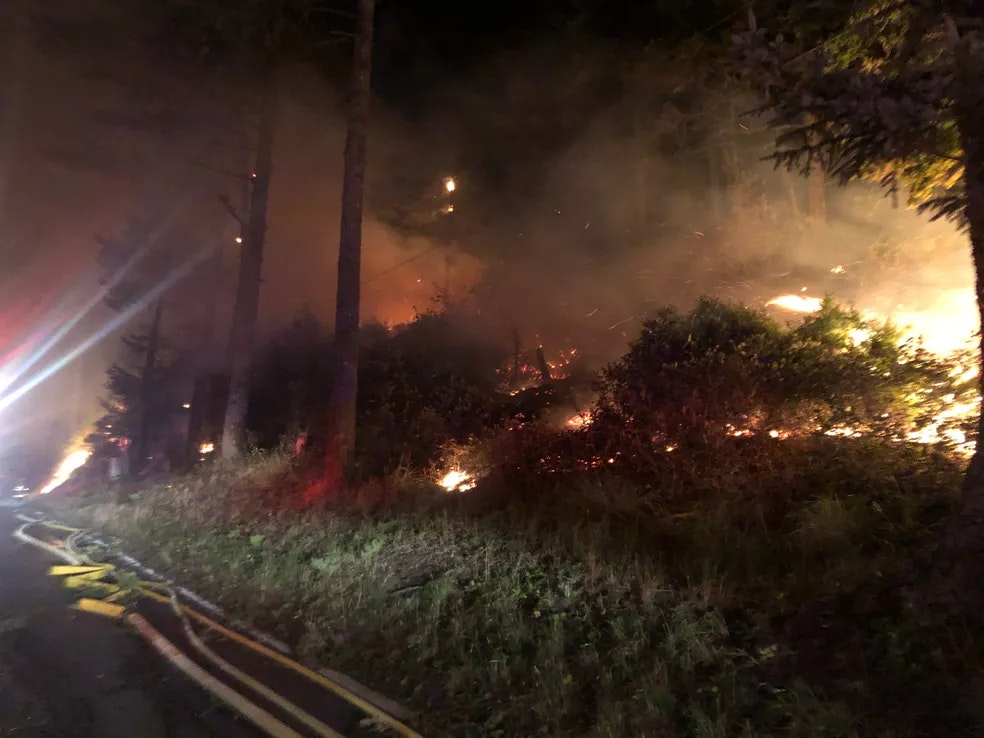 Another angle of a wildfire with intense flames.