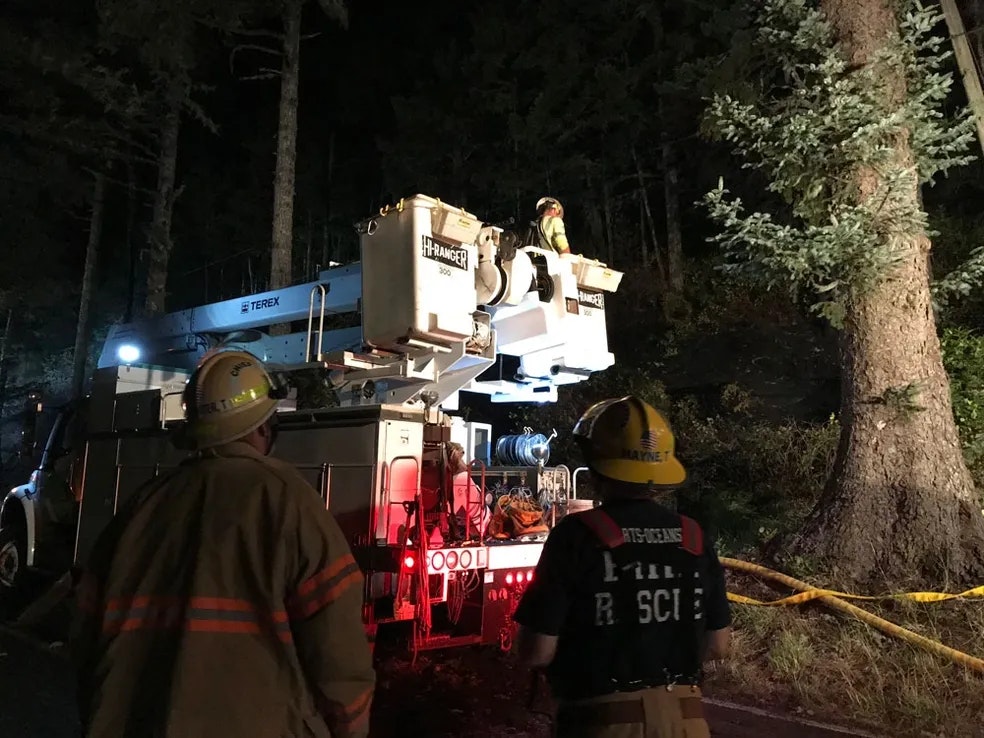 Tillamook PUD arrives to fix downed power line. 