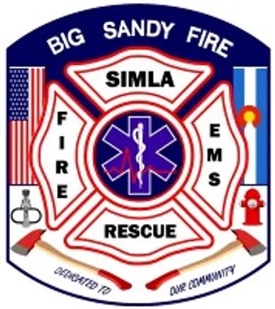 An emblem with "Big Sandy Fire Simla Fire EMS Rescue," star of life symbol, U.S. flag, fire hydrant, and firefighting equipment.