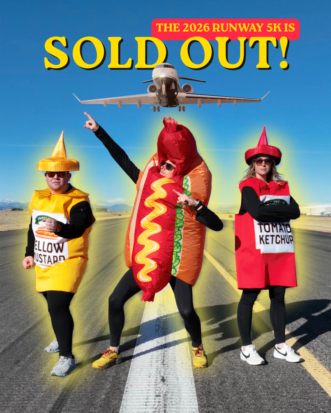 Three people in food-themed costumes pose on a runway, celebrating the sold-out 2026 Runway 5K event.