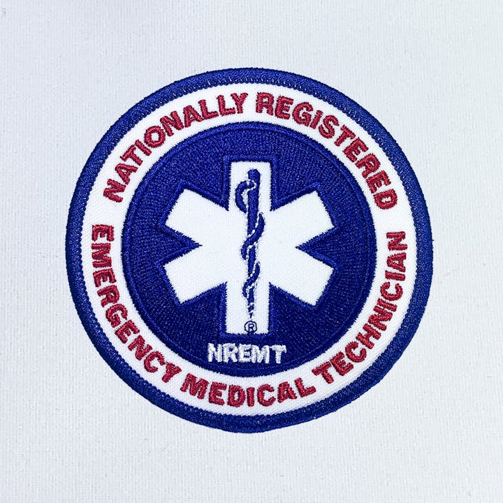Nationally Registered Emergency Medical Technician (NREMT) patch logo.