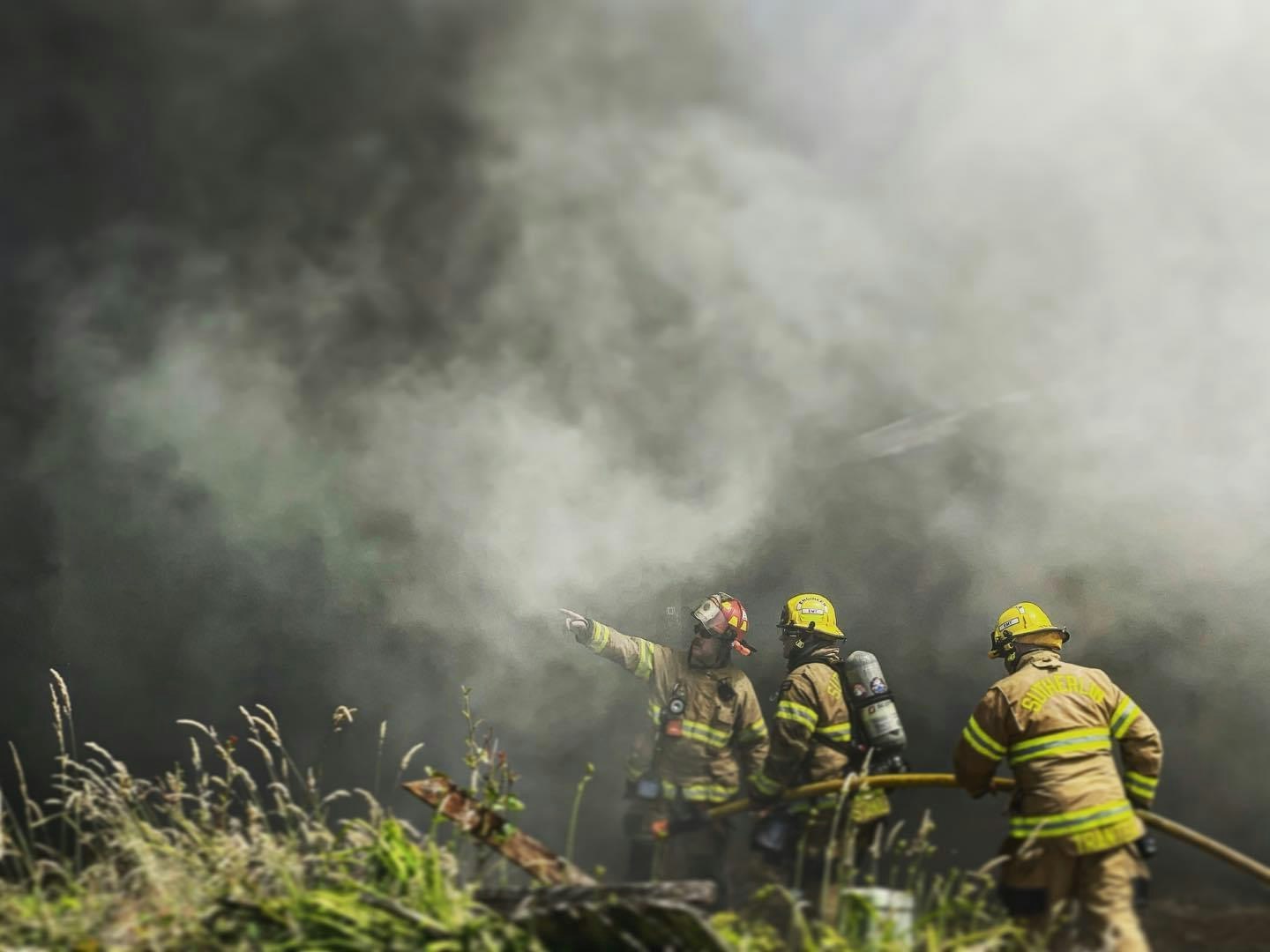 Than Captain Fox showing firefighters where assistance is needed during a burn to learn in Winston.