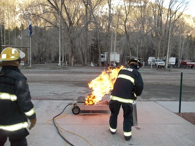 Firefighters training with a controlled blaze.
