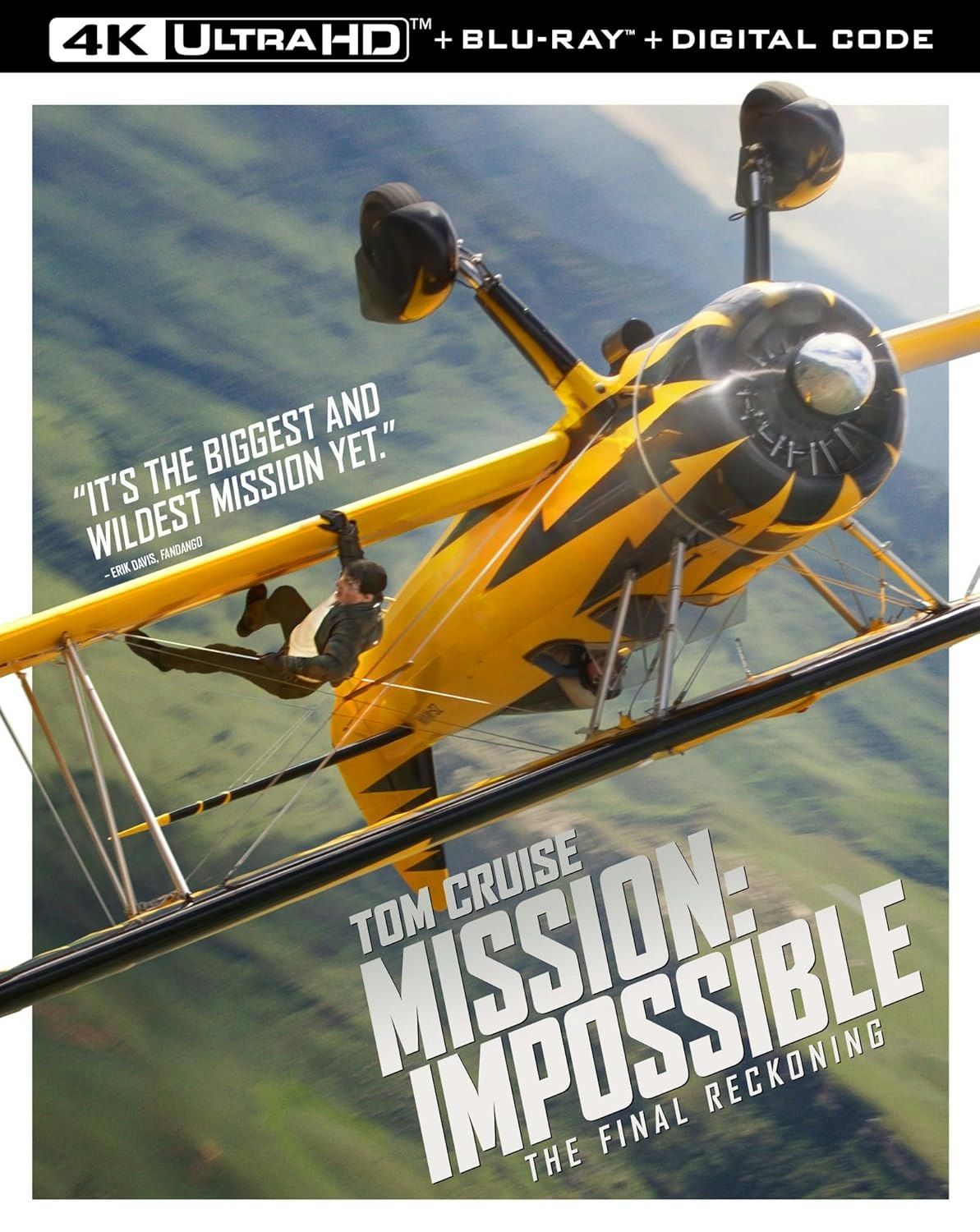 A person hanging from a biplane in an action scene from "Mission: Impossible - The Final Reckoning" in 4K Ultra HD.
