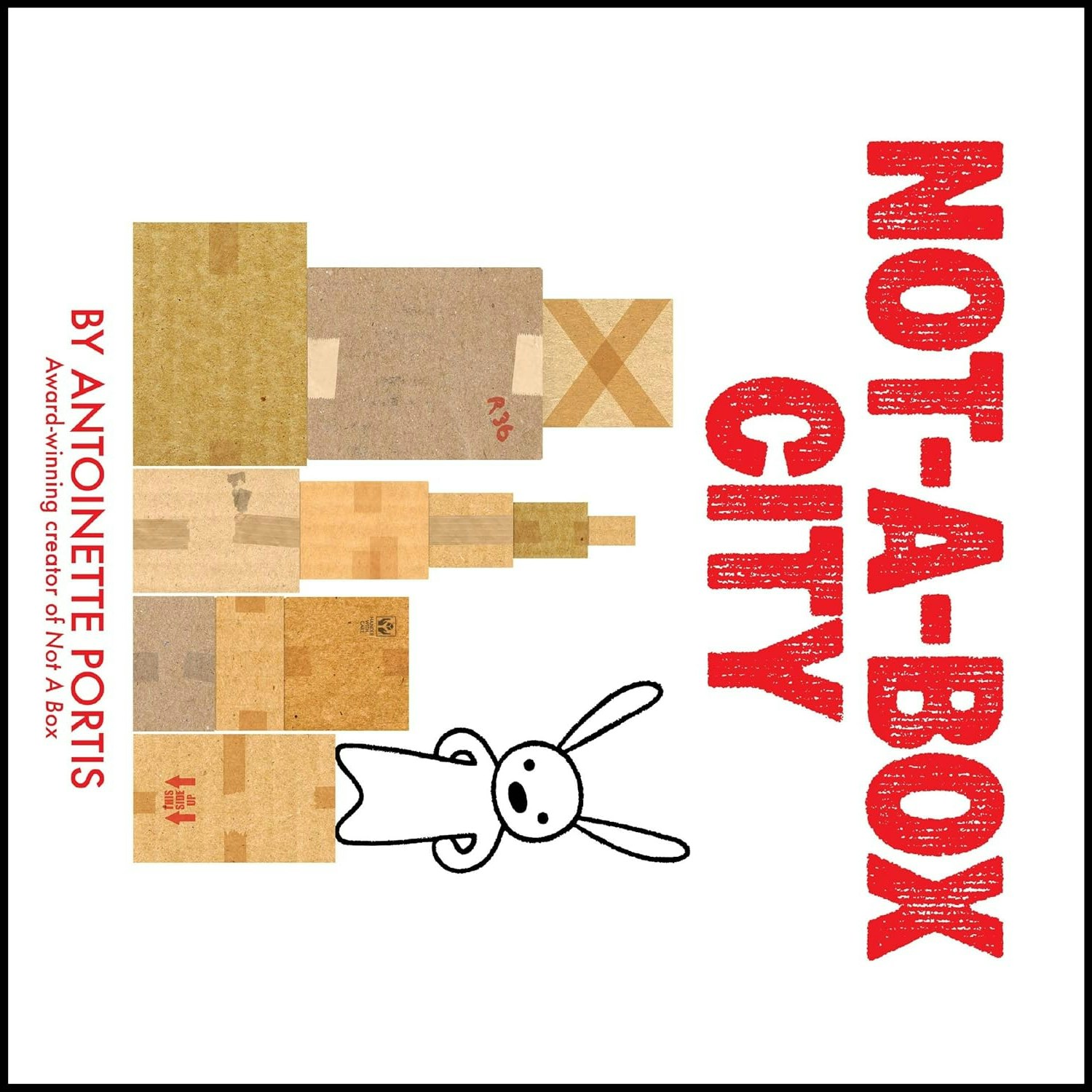 It's a book cover with the title "NOT-A-BOX CITY" and a drawing of a rabbit next to box buildings, by Antoinette Portis.