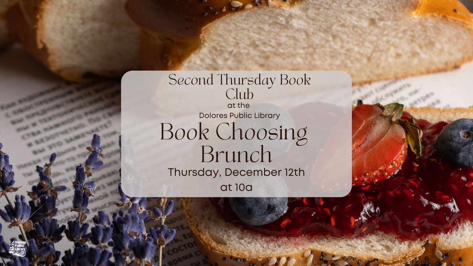 Book club invitation card on top of bread, berries, and print material.