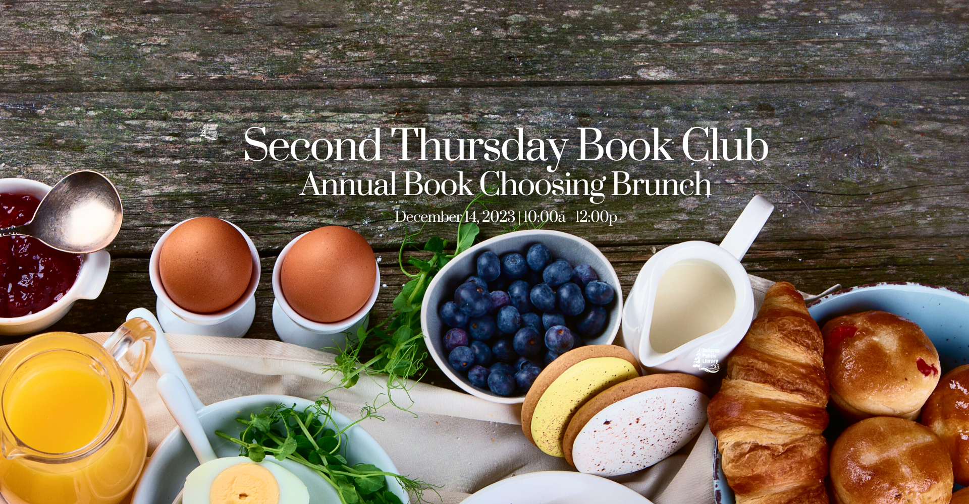 A brunch spread for the Second Thursday Book Club, featuring eggs, blueberries, pastries, and drinks, on December 14, 2023.