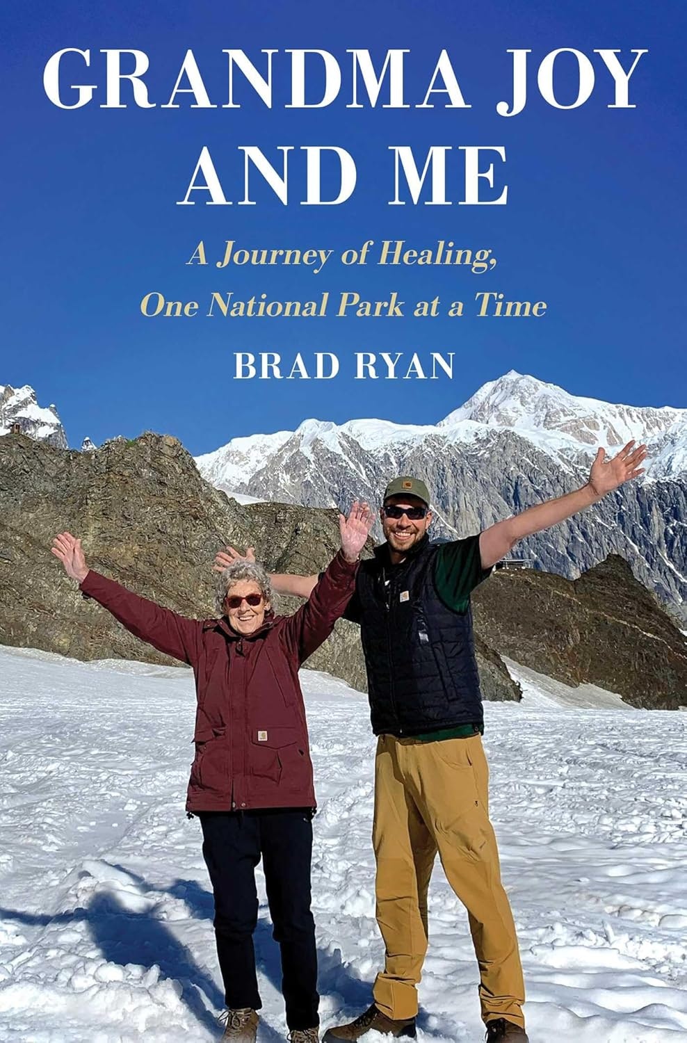The image features a book titled "Grandma Joy and Me" by Brad Ryan, celebrating national park adventures and healing with a joyful duo.
