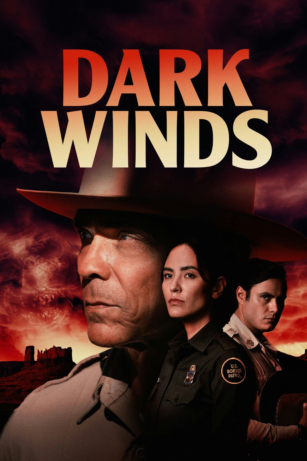 A dramatic poster for "Dark Winds" featuring three serious individuals with a desert backdrop and a stormy sky.