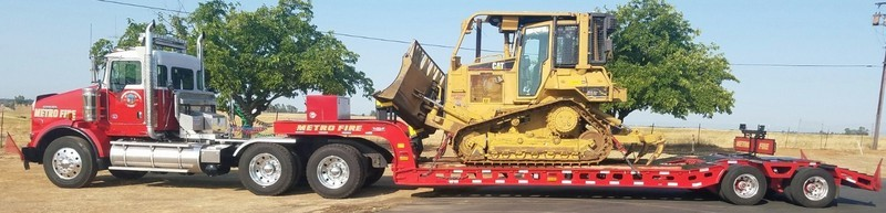 May contain: tractor, vehicle, transportation, wheel, machine, bulldozer, and truck