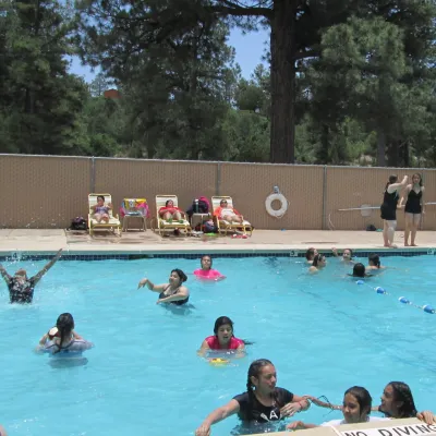 May contain: pool, water, swimming pool, leisure activities, person, sport, swimming, water sports, adult, female, and woman
