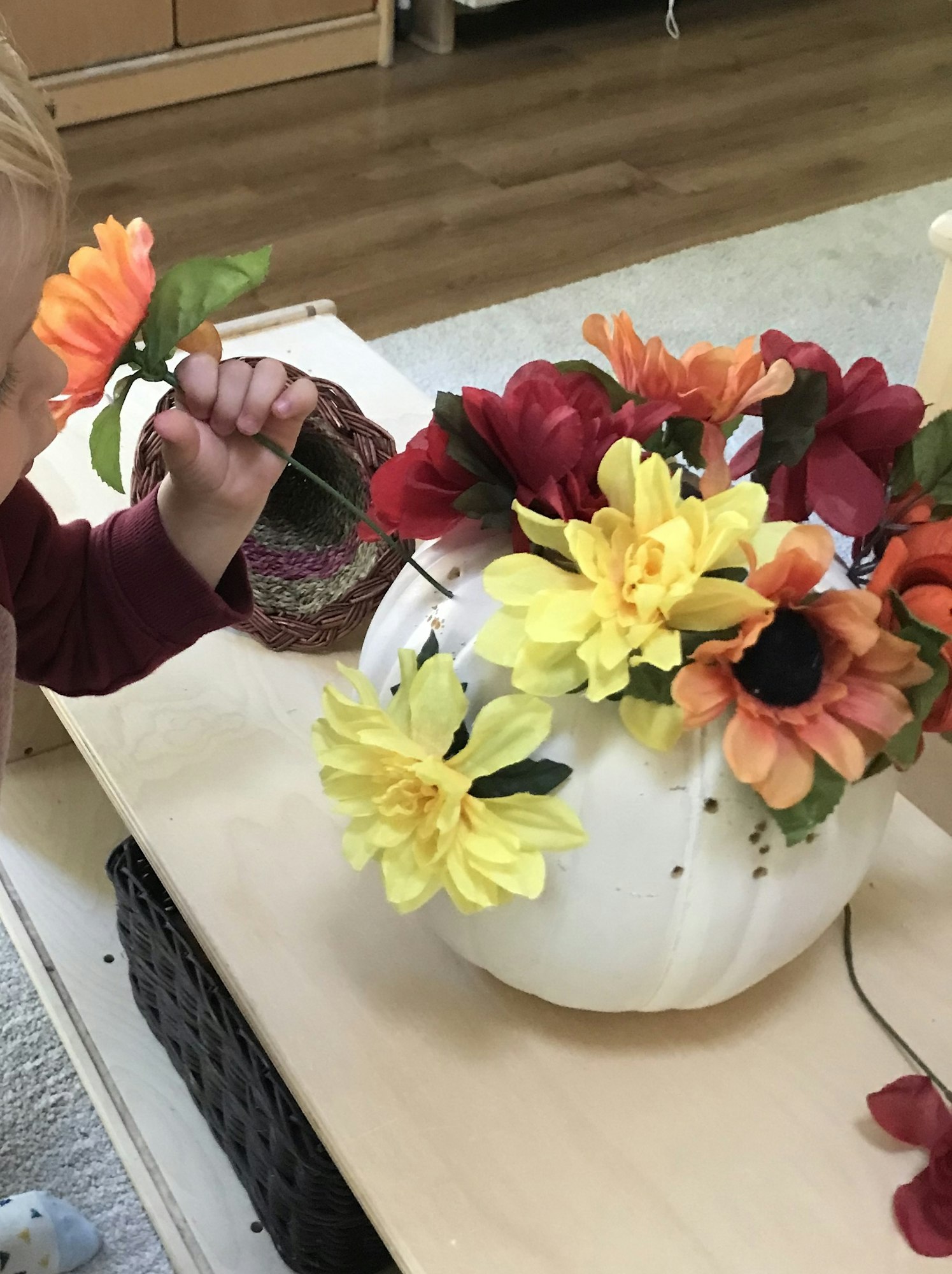 May contain: person, human, plant, flower bouquet, flower, flower arrangement, and blossom