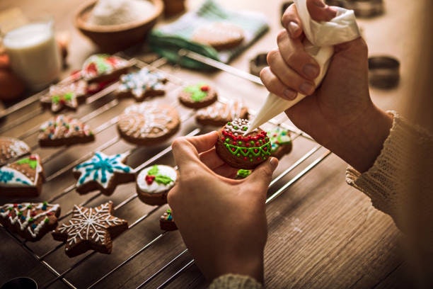 May contain: icing, dessert, cake, cream, food, creme, person, human, cookie, biscuit, sweets, and confectionery