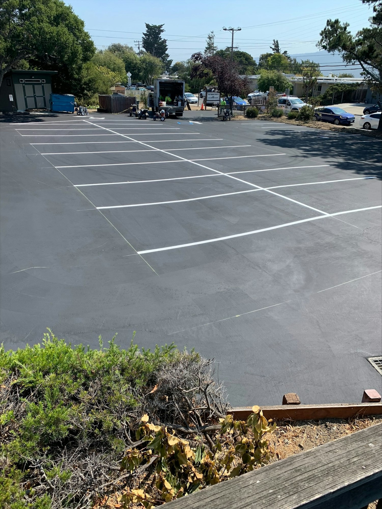 May contain: car, automobile, transportation, vehicle, parking lot, and parking