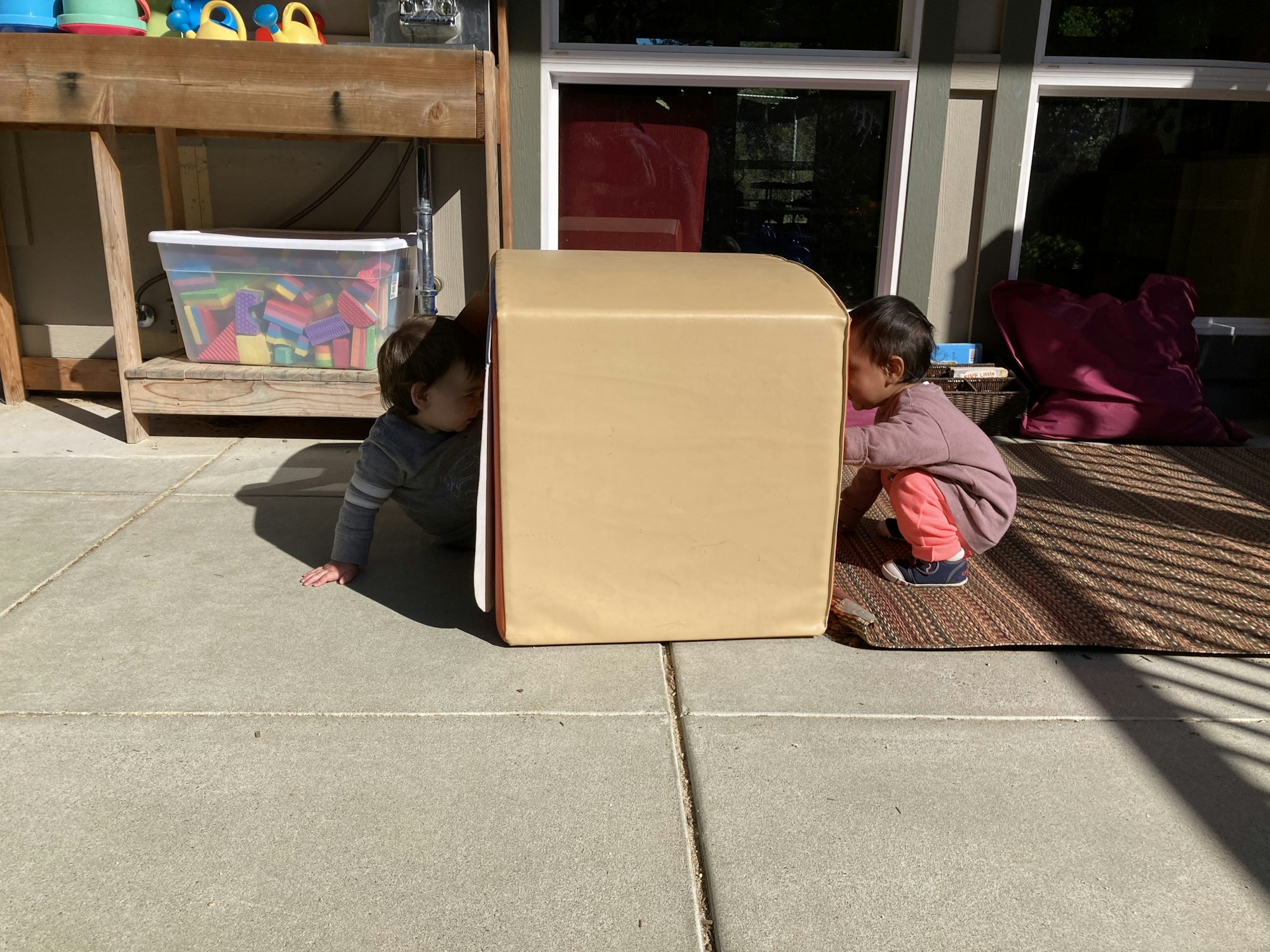 May contain: person, human, furniture, wood, shelf, and box