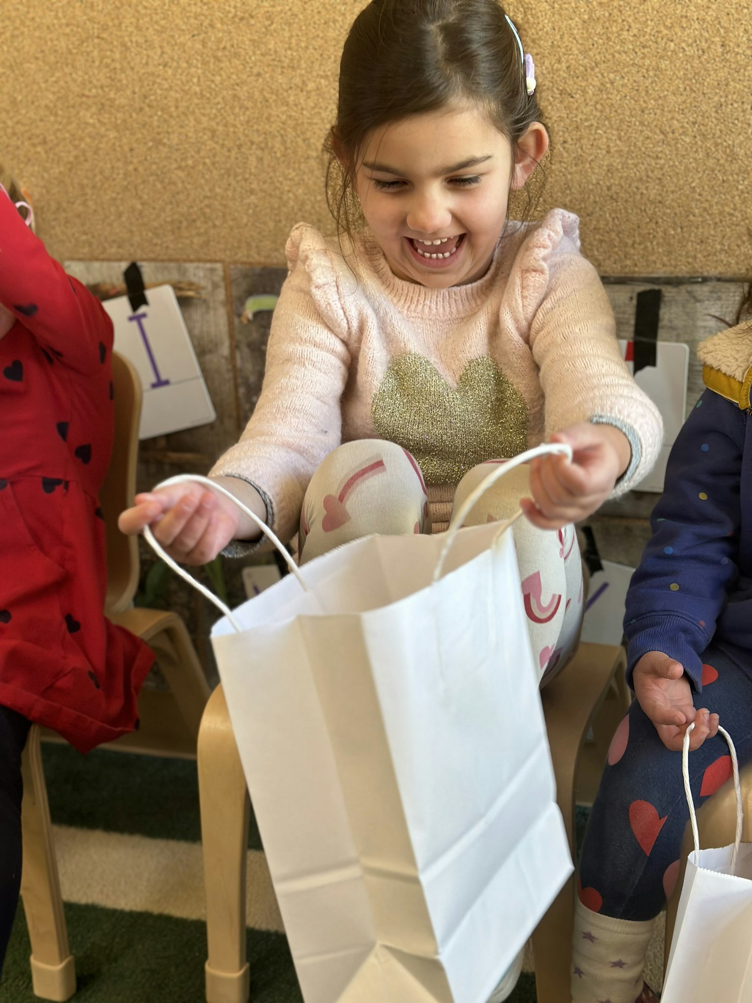 May contain: bag, accessories, handbag, child, female, girl, person, face, head, photography, portrait, couch, furniture, clothing, and coat