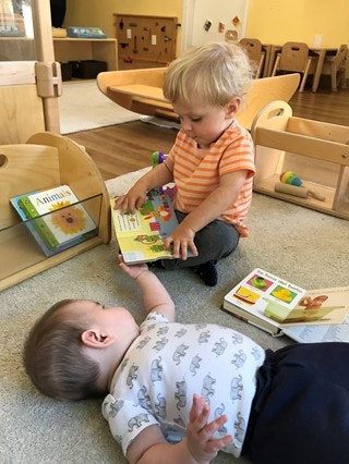 May contain: person, human, wood, and kindergarten