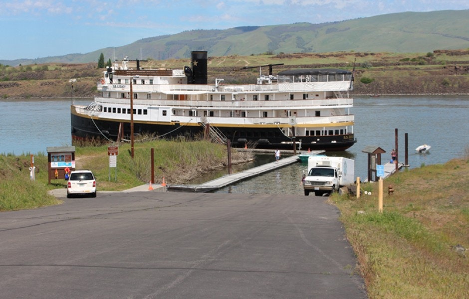 A large boat docked at the marina